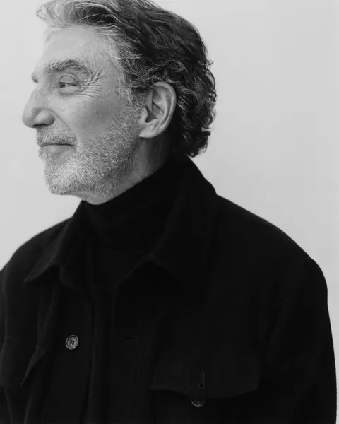 Black-and-white profile portrait of Chuck Lorre photographed for Playboy at Milwood Studios