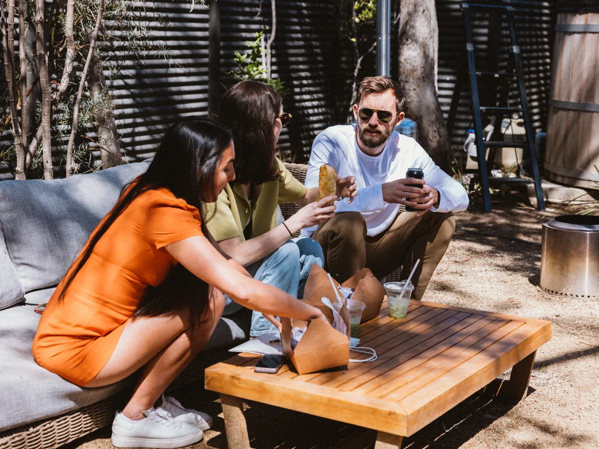 Guests relaxing in the private courtyard at Milwood Studios