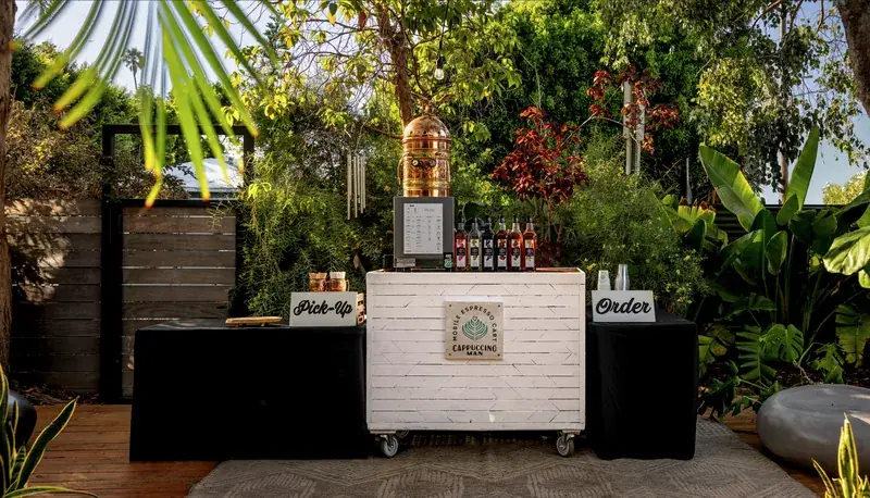 Cappuccino Man espresso cart set up in the courtyard at Milwood Studios